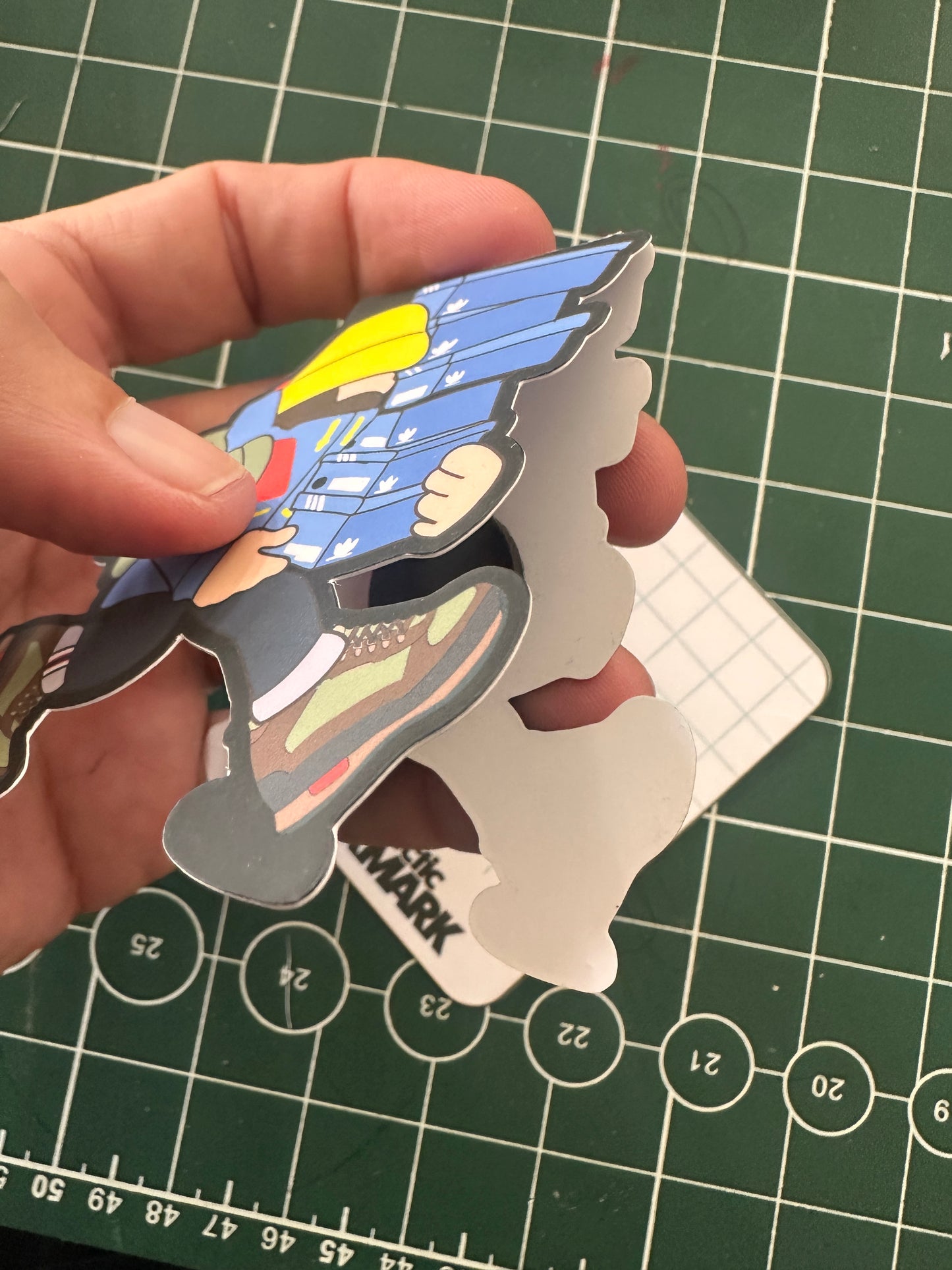die cut adi ladi magnetic bookmark with laminated backing card 
